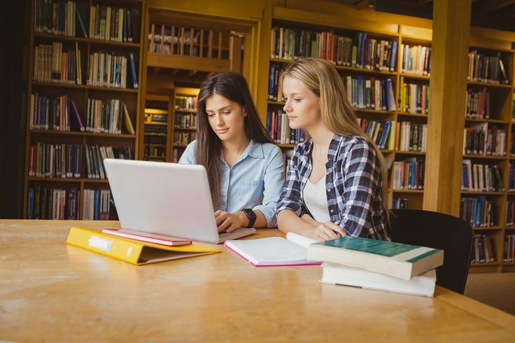 serious students using laptop